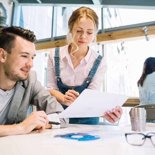 collaborating-man-woman-with-papers